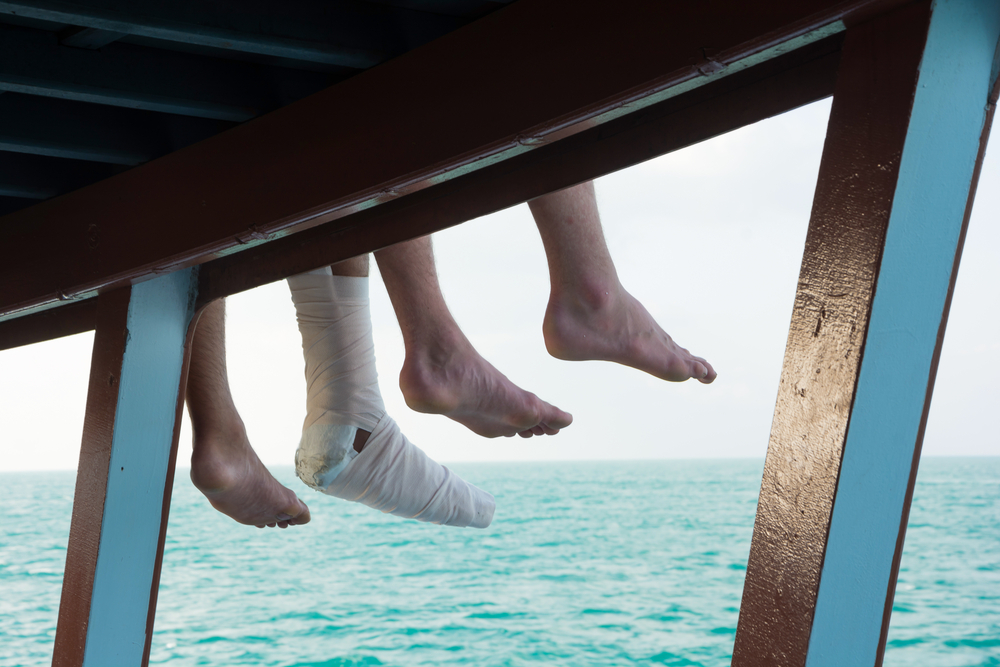 Image Credit: Shutterstock | https://www.shutterstock.com/pic-361895219/stock-photo-safety-trip-in-your-holiday-tourist-s-injury-leg-sitting-at-the-side-of-boat-sundeck-during-traveling-in-the-sea.html?src=WI2-1AcggJ8WrXeFuGlRzg-1-0