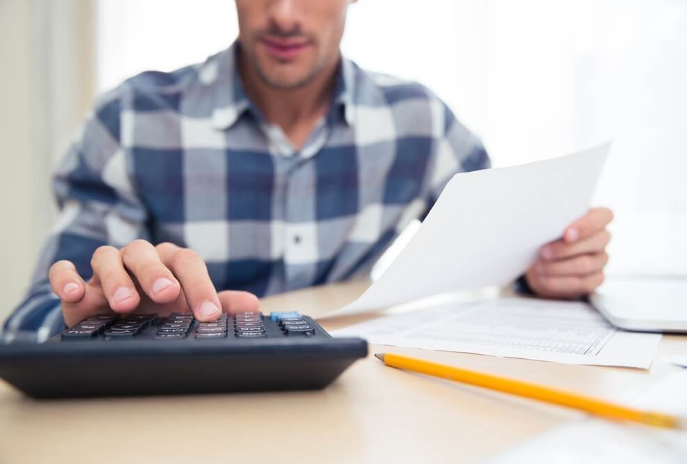 Image Credit | http://www.shutterstock.com/pic-321796418/stock-photo-closeup-portrait-of-a-man-with-calculator-checking-bills-at-home.html?src=ft3mfMXPX3Jhqc1q1DGDVg-2-6