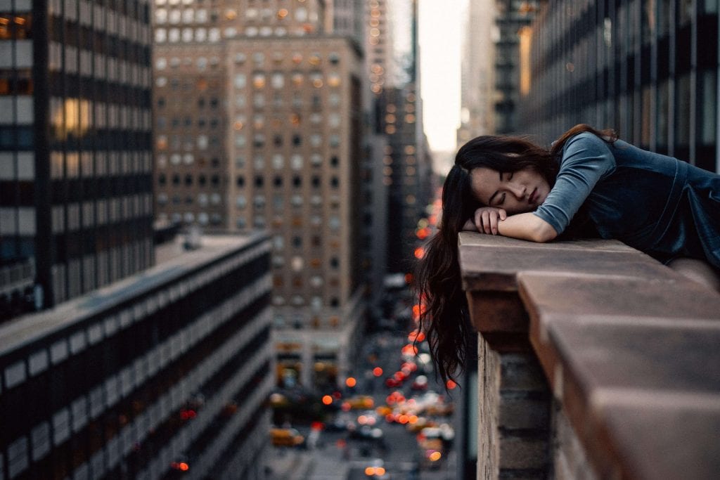 Girl leaning on walll