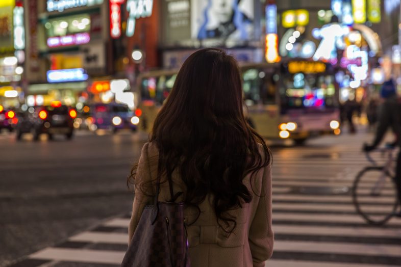 Girl crossing street in Tokyo, Japan
